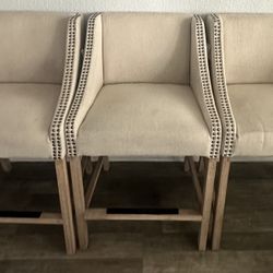 3  beige high chairs