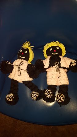 pair of hand made dolls
