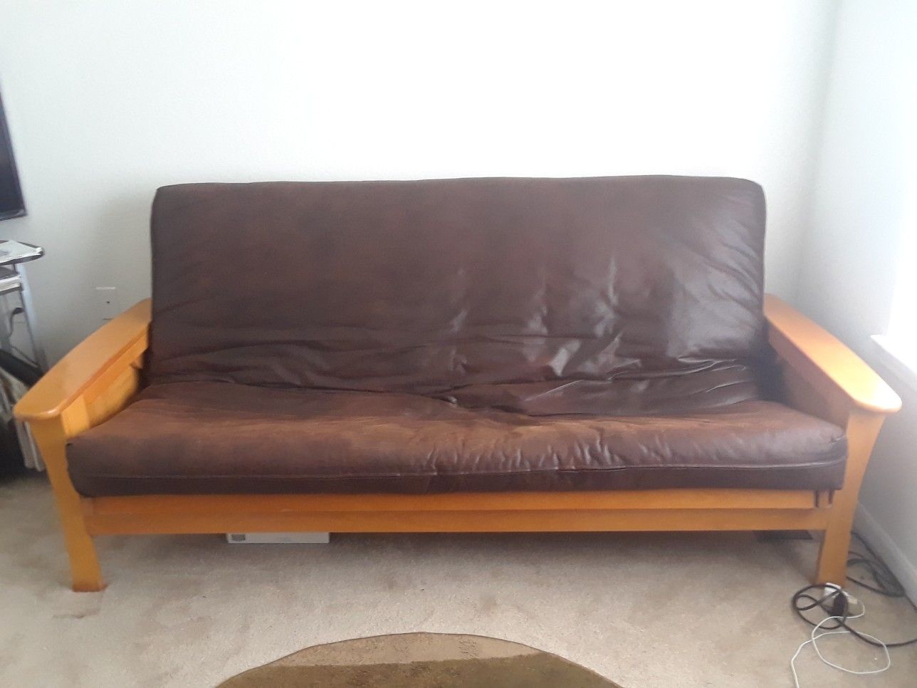 Futon frame is real wood strong sturdy with mattress like a leather matieral full size..both sides open up just opened 1side so you could see