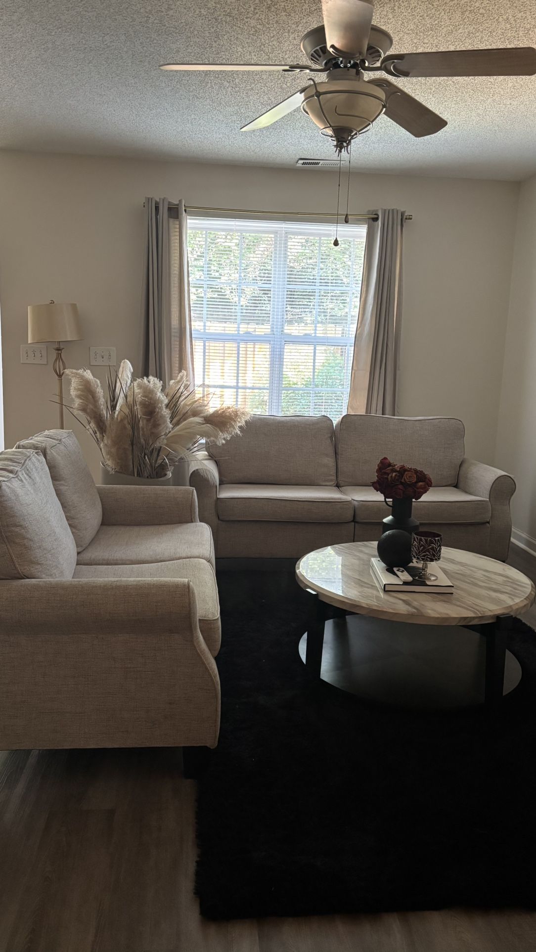 Beige Couches + Round Marble Table