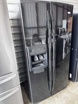 Black smooth whirlpool refrigerator side by side  With water and ice dispenser