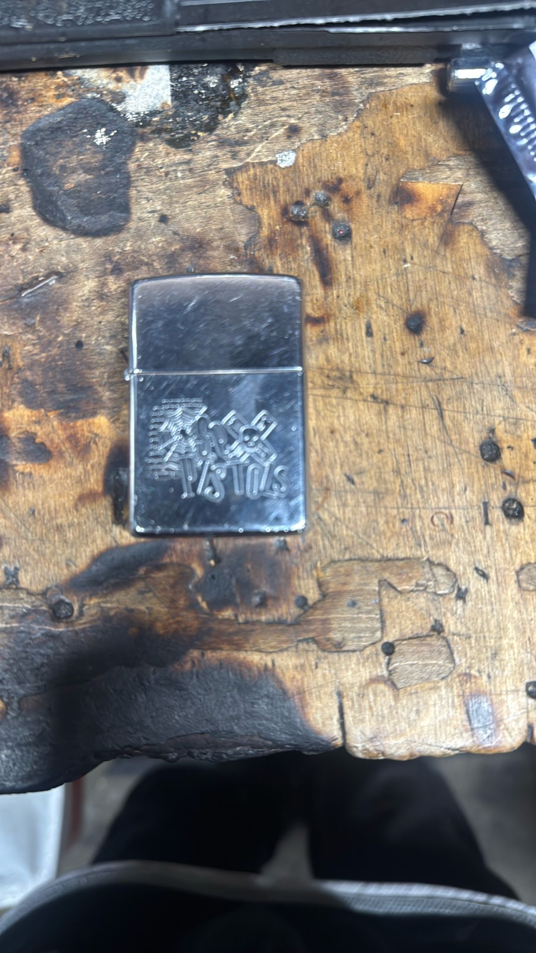 zippo lighter with sex pistols engraved on it