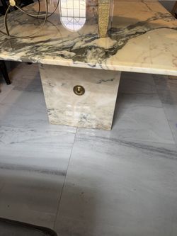 Marble table with gold trim