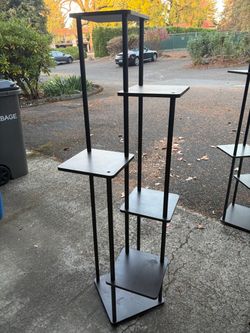 Black 6-Tier Metal Display Shelf 2 available. $40 for one, $70 for both