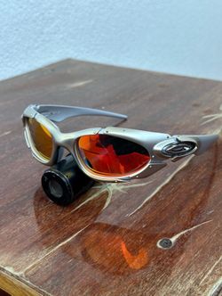 Oakley Plate Silver Wrap Polarized Sunglasses – Y2K Futuristic Sport Frame (Orange Lens)