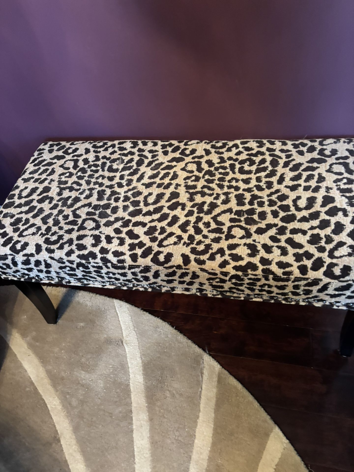 padded bench with nailhead trim