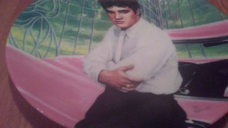 Elvis Presley collectible plate by his pink Cadillac