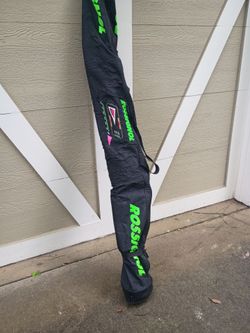 Cross country rossignol snow skis with sticks and bag