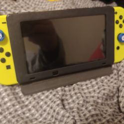 Nintendo Switch W/Neon Controllers.