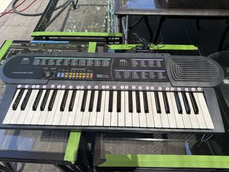 Optimus Concertmate-690 portable electronic keyboard.