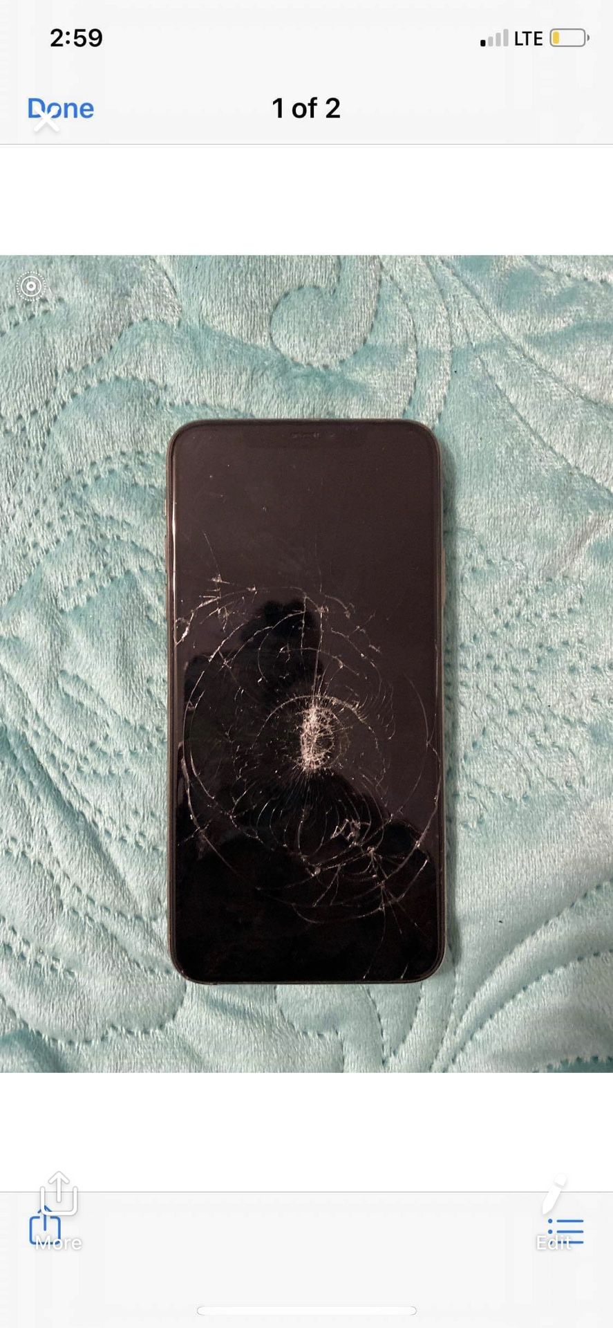 Cracked iPhone 11 Pro Max with cracked led lights