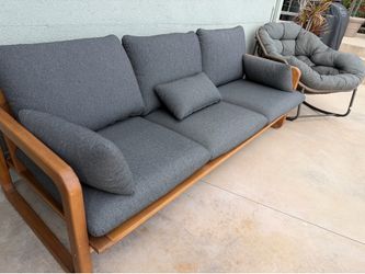 Teak outdoor sofa and oversize rocking chairs
