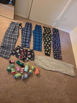 Kids pj's and socks lot sold together.