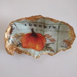 Pumpkin with thankful paper print decoupaged onto oyster shell and finished with resin