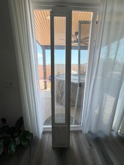Ideal PET Products Since 1979 Ideal Pet VIP Vinyl “Tall” Pet Patio Door with Dual Pane Glass and 3-Part Flexible Flap. Fits 1 ½” -1 ¾” Vinyl Patio Tra