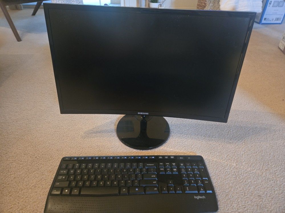 Samsung 24" LED curved monitor with Logitech keyboard