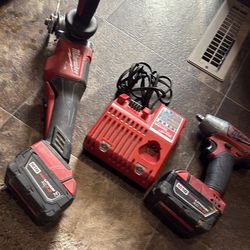 Milwaukee fuel 3/8 impact wrench and grinder 2 5amps battery and battery and charger