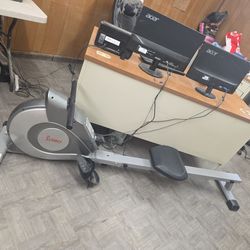 Magnetic rowing machine