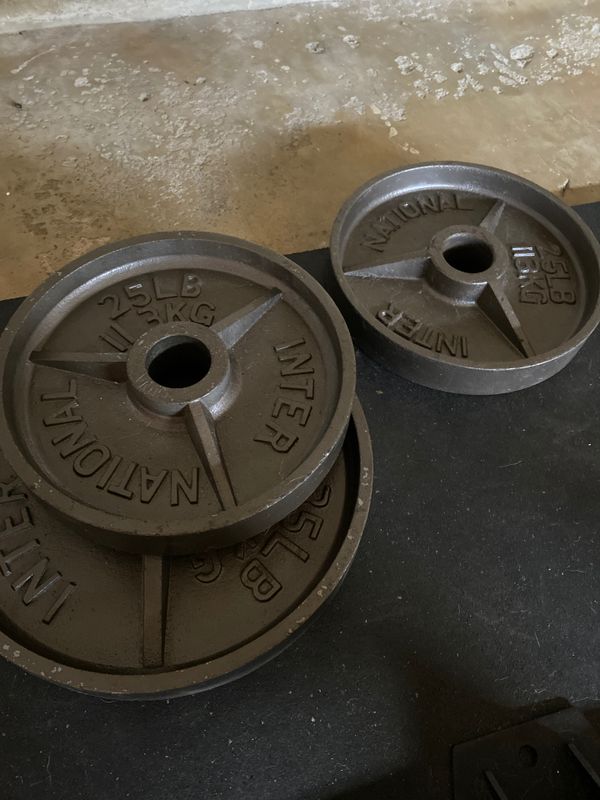 (Pair) of 35lb & 25lb Olympic Cast Iron Plates for Sale in San Diego