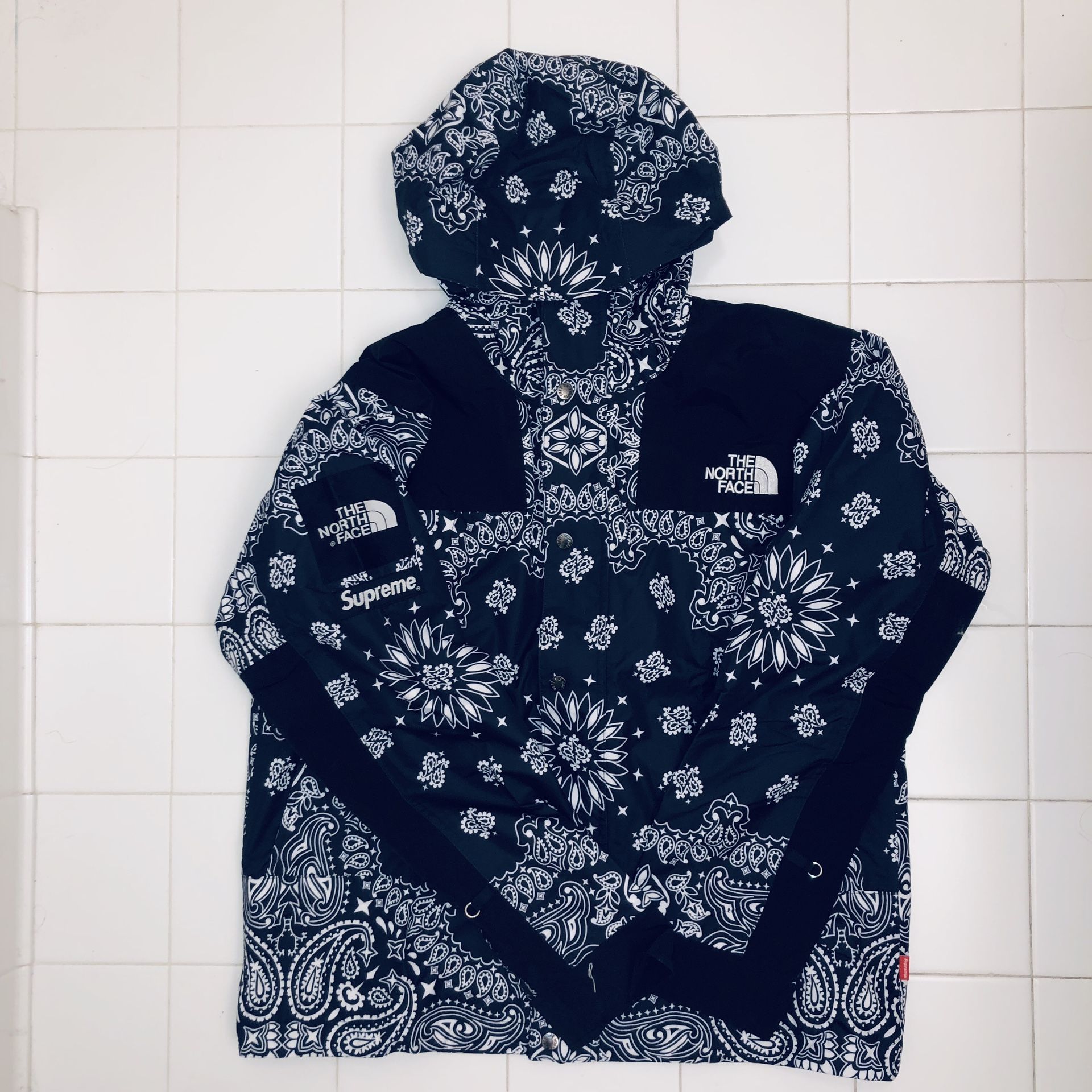 Supreme North Face Paisley Jacket available in store. 💙🖤