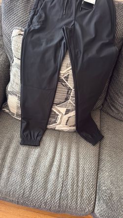 Nike 24.7 PerfectStretch Women's Dri-FIT UV Protection High-Rise Tapered Pants