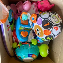 Kids clothes, box of shoes and toys
