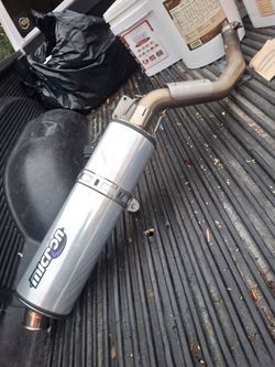 Micron slip-on motorcycle exhaust muffler.
