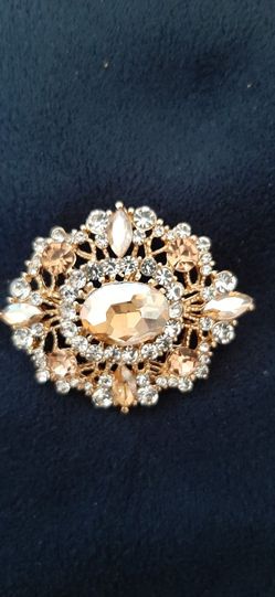 Elegant vintage look brooch adorned with crystals
