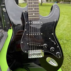 Electric Guitar With Amp, Case, Stand, And Lots Of Picks