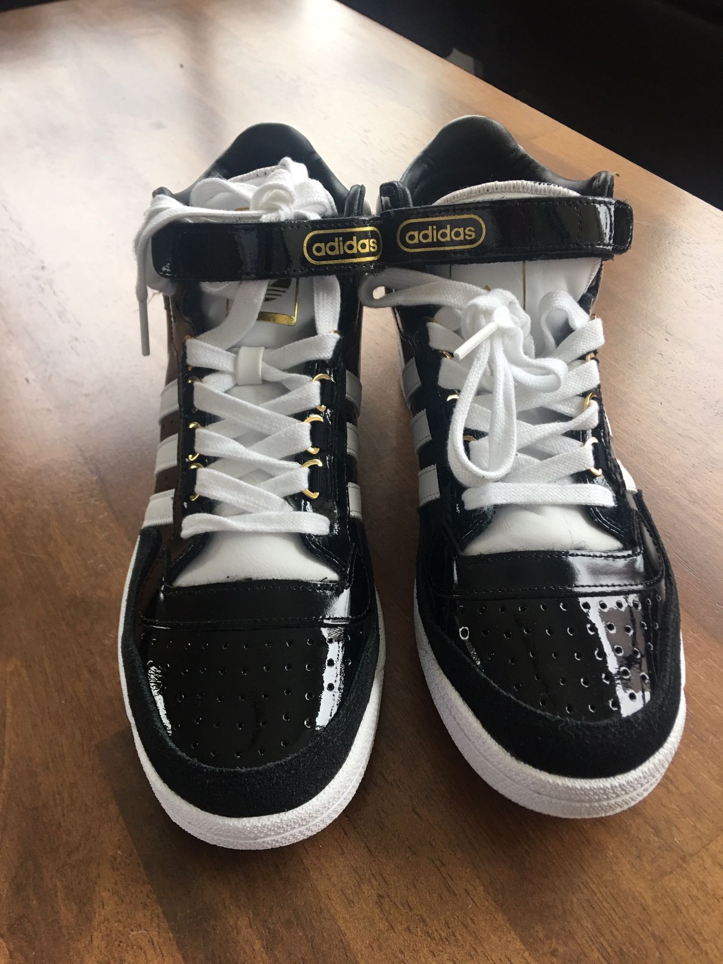 Black, White & Gold High Top Adidas. Men’s 10 1/2