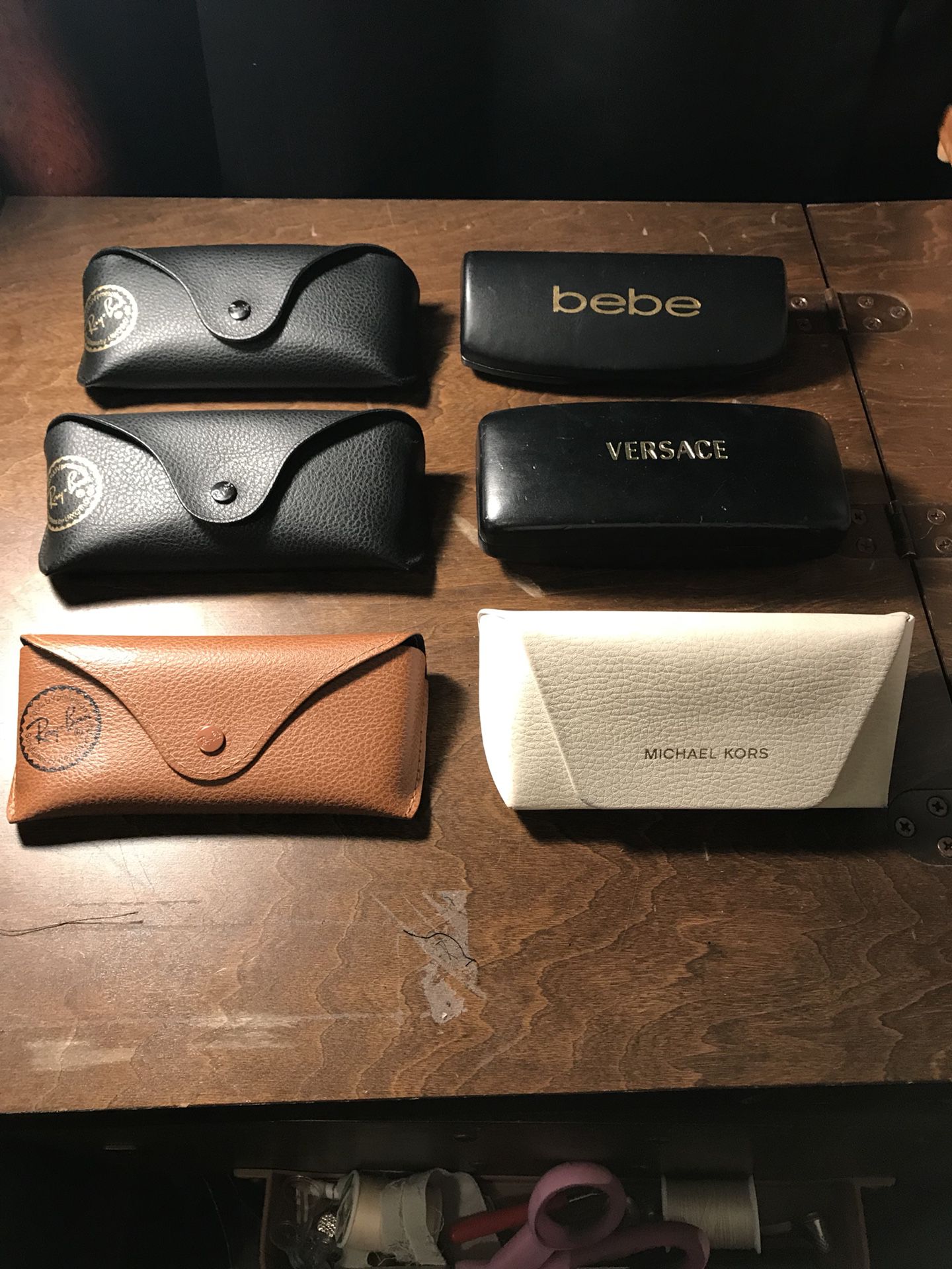 3 Ray Ban sunglass cases 1 Michael Kors 1 Bebe & 1 Versace 6$ each or two for 10 pick up onlyTan one is no longer available