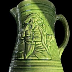 Gorgeous green antique McCoy Pottery buccaneer pitcher. This rare 1920s era McCoy pirate pottery tankard pitcher has Shield Mark 6.