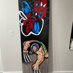 Mural painting of Wolverine and Spiderman