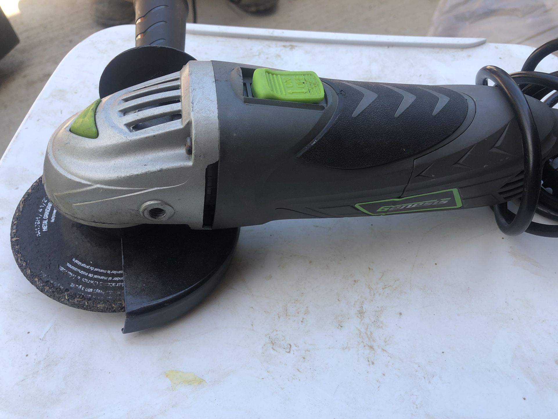 GENESIS 6 Amp 4-1/2 in. Angle Grinder with Grip Barrel, 2-Position Handle, Lock Switch, Grinding Wheel and Aux Handle ONLY $25