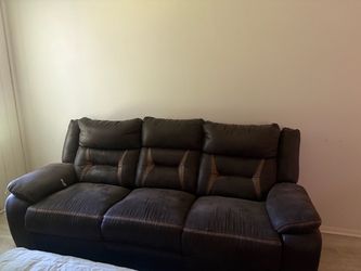 2pc Ashley reclining sofa and loveseat with fire pit