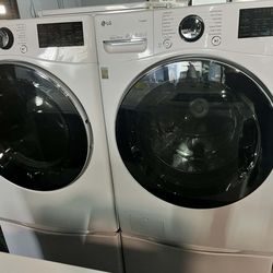 LG 4.5 Cu. Ft. Front Load Washer and 7.4 Cu. Ft. Electric Dryer with TurboWash 360 Laundry Pair in White With Pedestals.