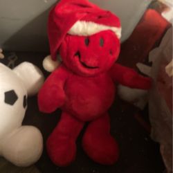 Happy face, red stuffed animal