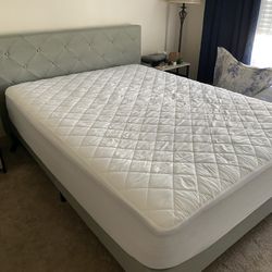 Queen size gray upholstered bed frame and mattress