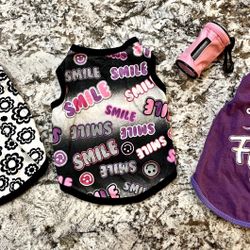 Girl Dog Clothes Size Small....Adorable Glittery Fun tops and pink case with poopie bags