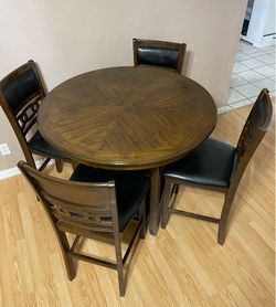 LIKE NEW 5-PC DARK BROWN FINISH HIGH TOP ROUND DINING SET (1 ROUND TABLE AND 4 PADDED CHAIRS)