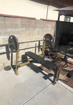 Olympic weight bench with (Olympic bar) & a set of 45’s