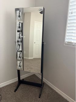 Mirror/jewelry holder