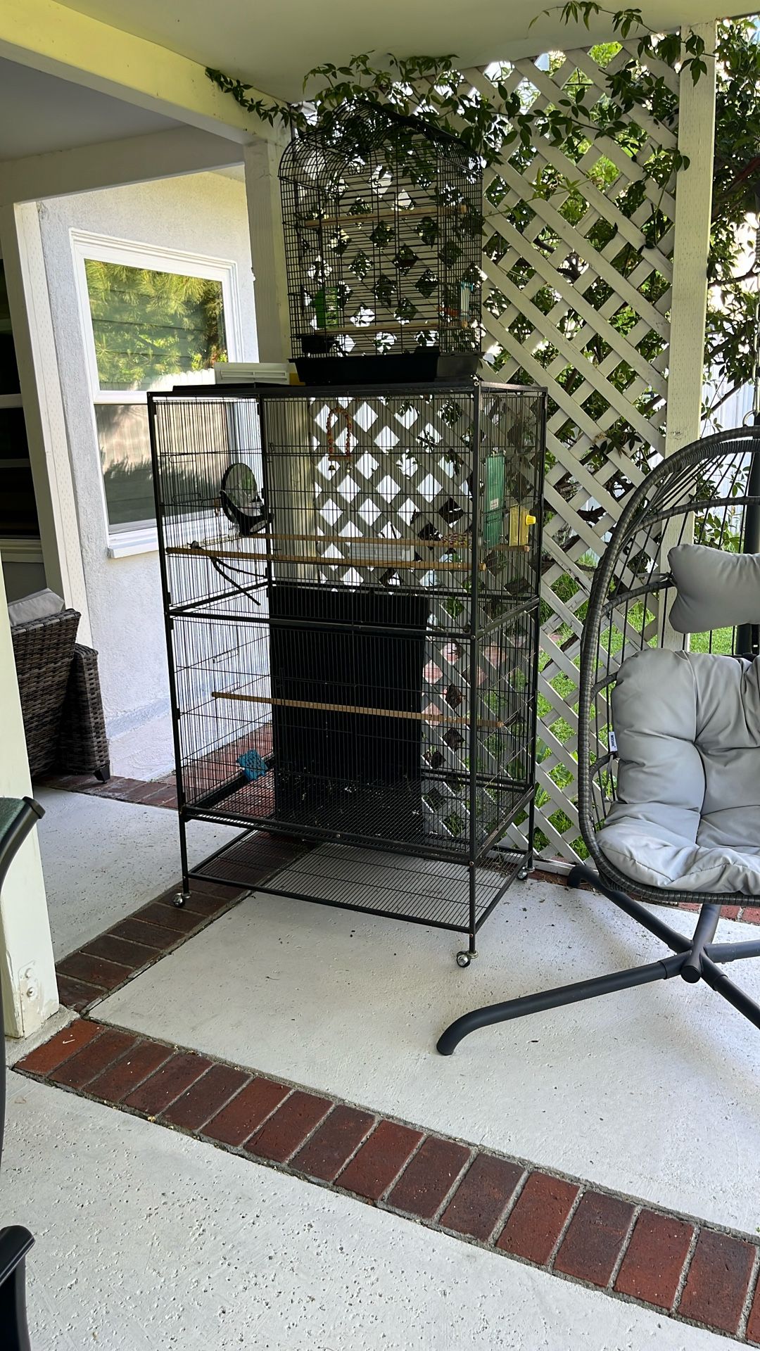 Large Bird Cage And A Smaller Cage