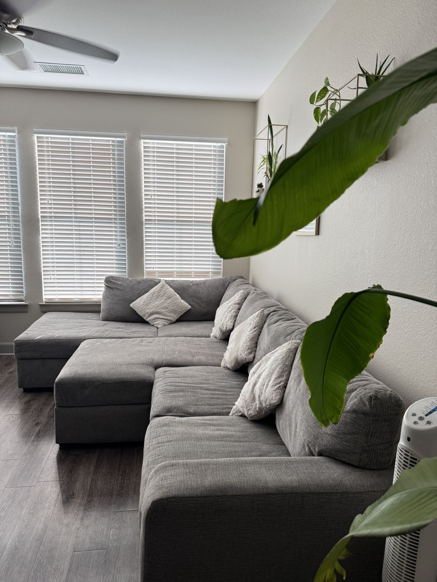 Three-piece fabric sectional couch with adjustable ottoman 