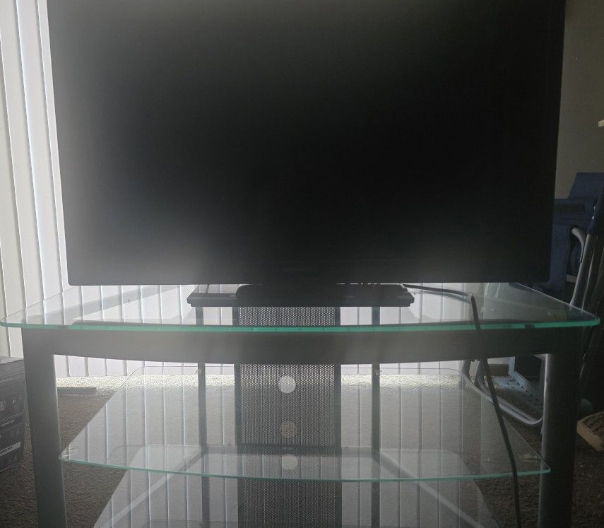 TV and 3-Tier Glass TV Stand