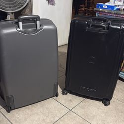 2 damaged Delsy suitcases. Very fixable.