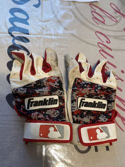 Boys batting gloves a little worn