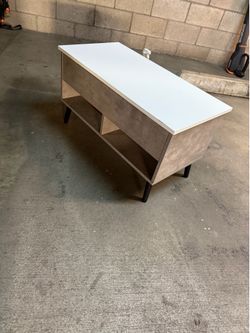Coffee table with compartment