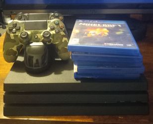 Playstation 4 Pro + 5 Games + Charging Doc For The Controllers