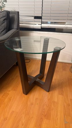 Glass table with wooden legs